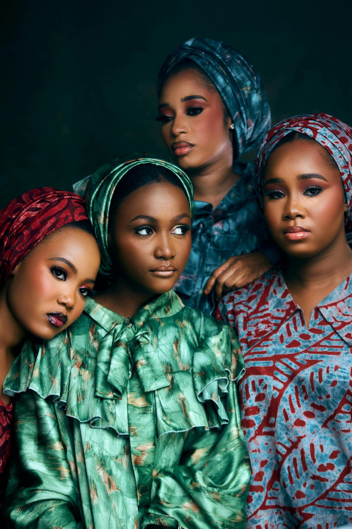 Group portrait of four Mozambican women in vibrant African attire