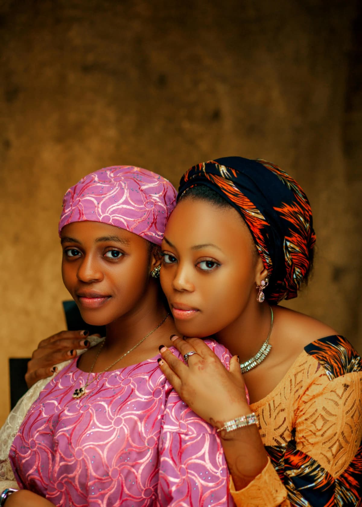 Two Mozambican women together in warm tones